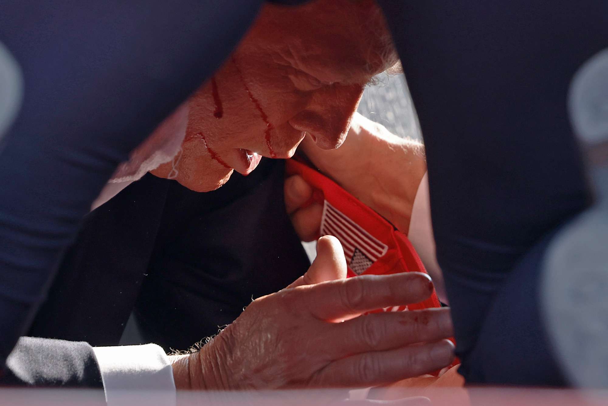  Republican presidential candidate former President Donald Trump is rushed offstage during a rally on July 13, 2024