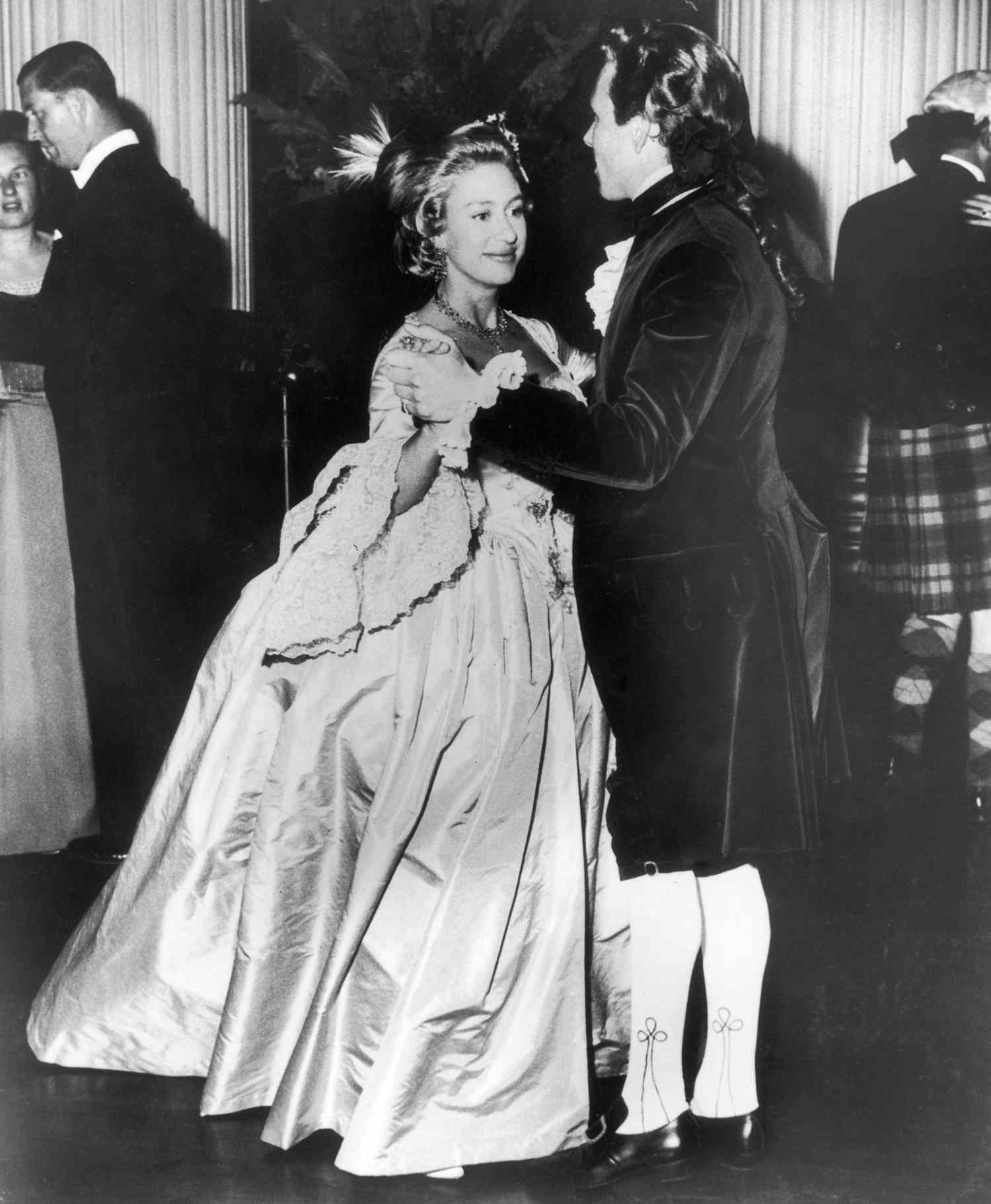 Princess Margaret (1930 - 2002), wearing an eighteenth Century ballgown