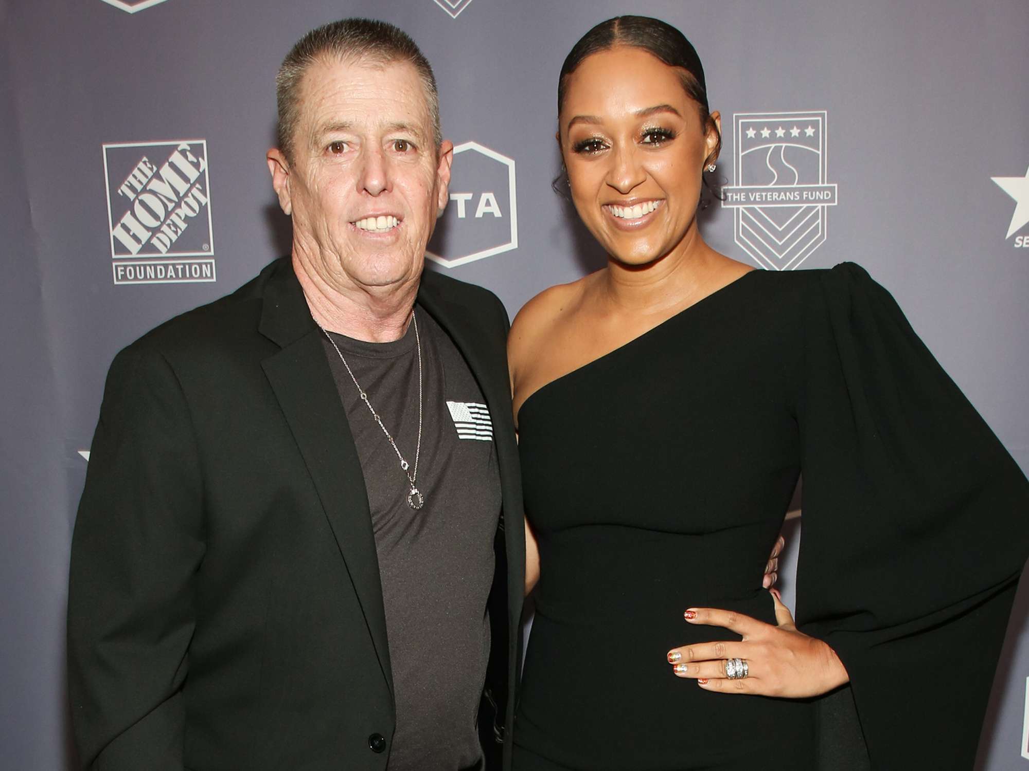 Tia Mowry (R) and her father Timothy Mowry attend the 2019 U.S. Vets Salute Gala