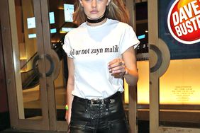 EXCLUSIVE: Gigi Hadid pictured wearing a shirt that says "lol Ur Not Zayn Malik" leaving Drakes Saturday Night Live after party at Dave and Buster's in Times Square New York City.