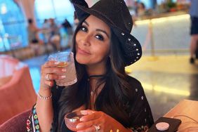 Nicole "Snooki" Polizzi with drinks and fries.