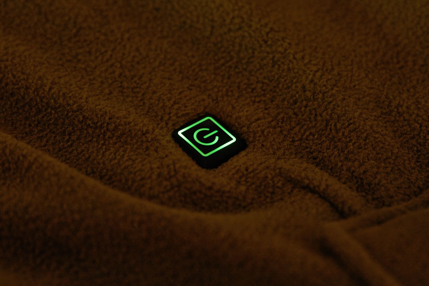 power button lit up on the Eddie Bauer Portable Heated Throw Blanket