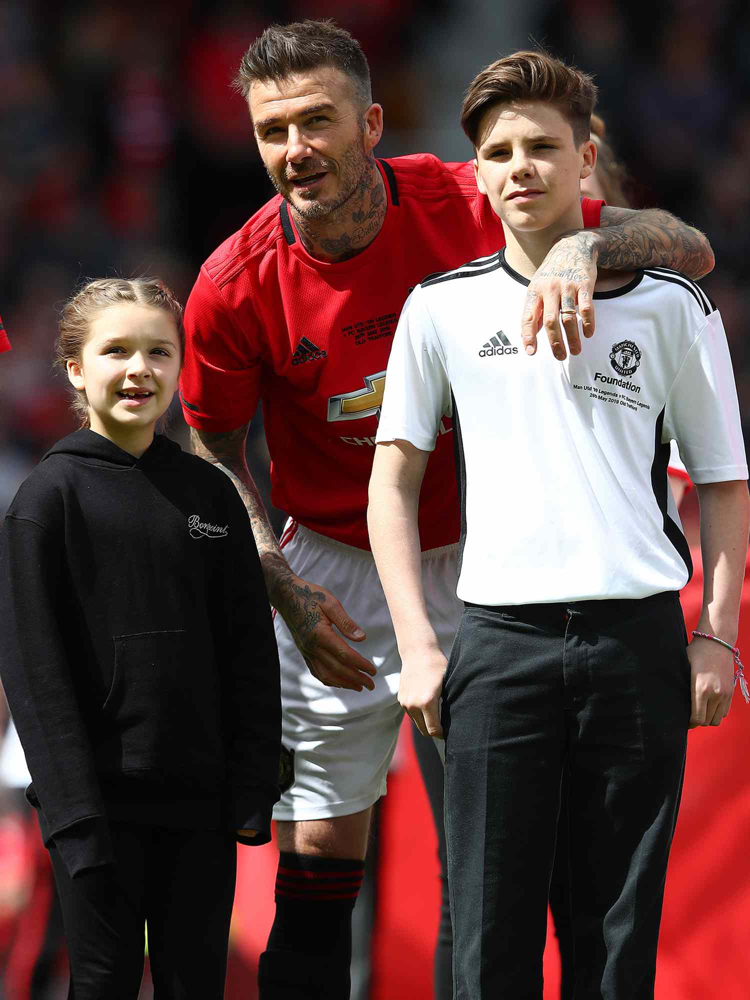 David Beckham with his children Harper and Cruz during the Manchester United '99 Legends and FC Bayern Legends match in 2019