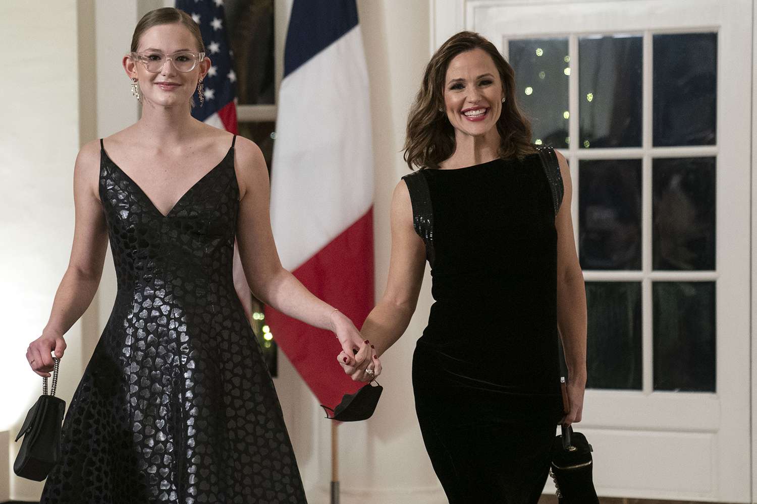 Actress Jennifer Garner, right and Violet Affleck arrive to attend a state dinner in honor of French President Emmanuel Macron and Brigitte Macron hosted by US President Joe Biden and First Lady Jill Biden at the White House in Washington, DC, US, on Thursday, Dec. 1, 2022.