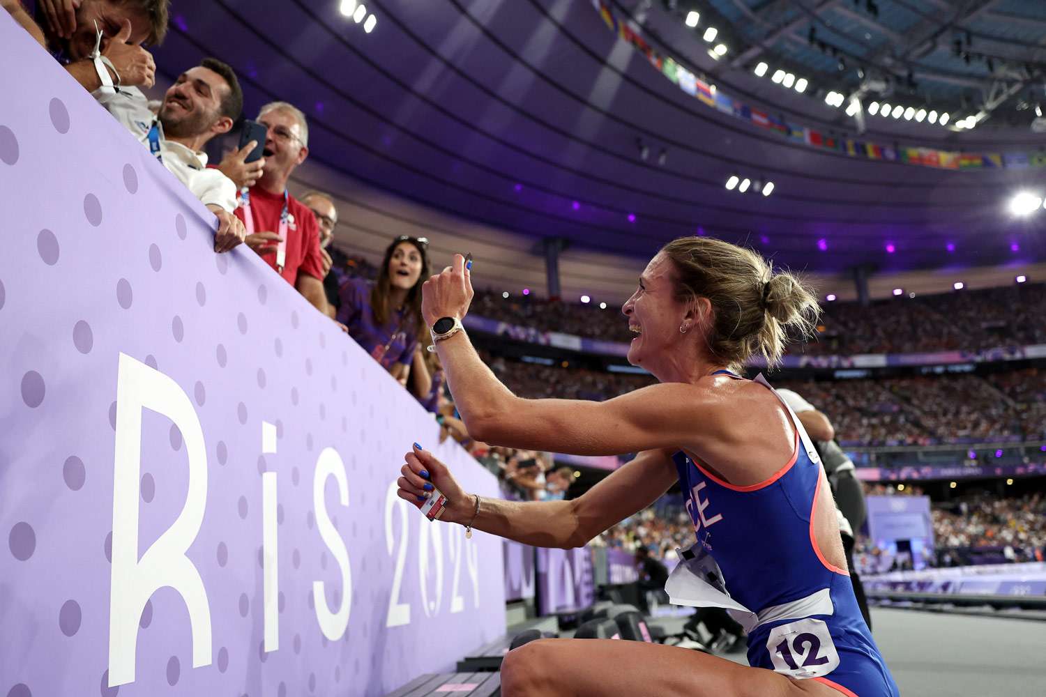 Alice Finot of Team France applauds fans after competing in the Women's 3000m Steeplechase final on day eleven of the Olympic Games Paris 2024 at Stade de France on August 06, 2024