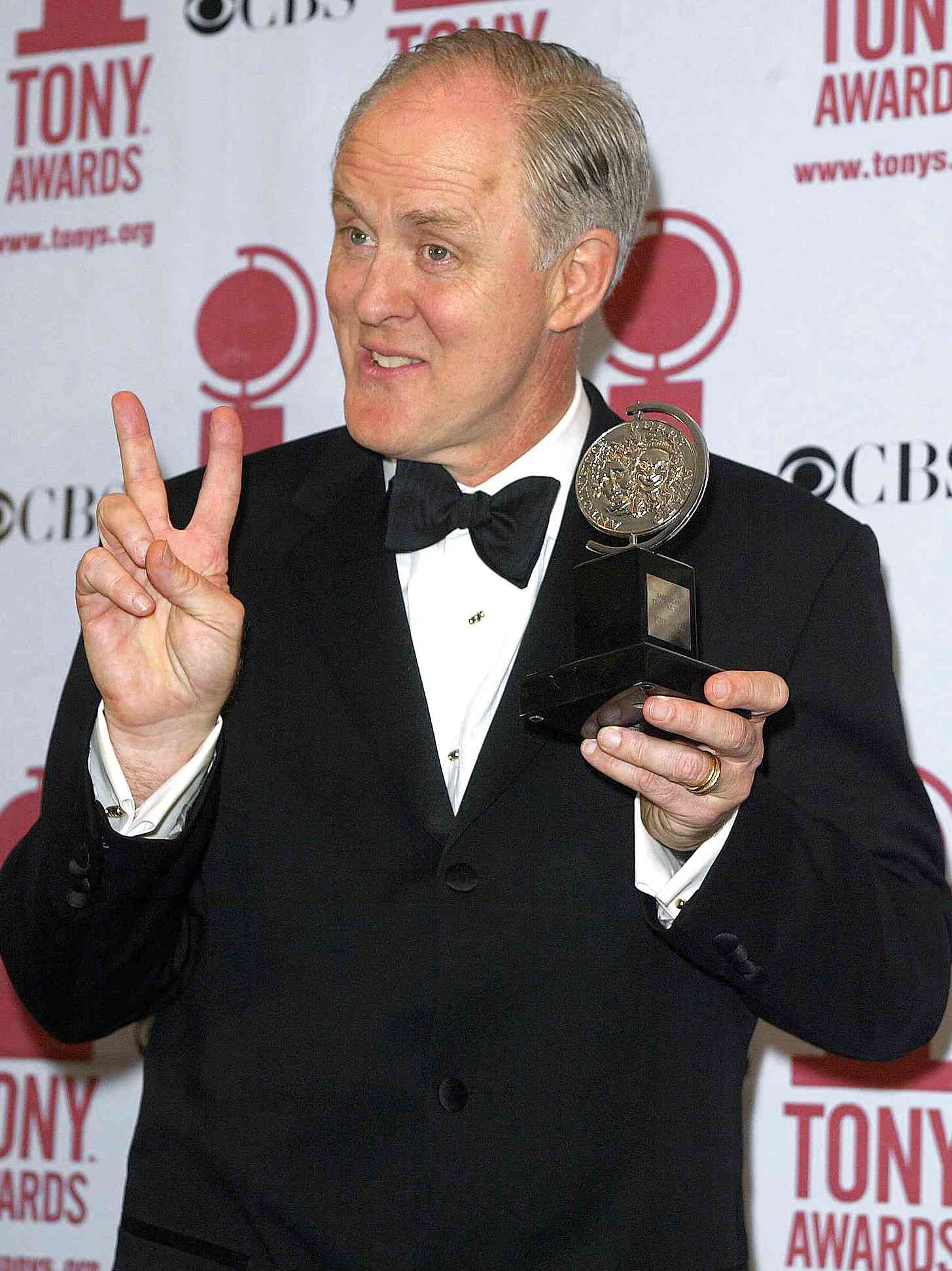 US actor John Lithgow holds up his Best Leading Ac