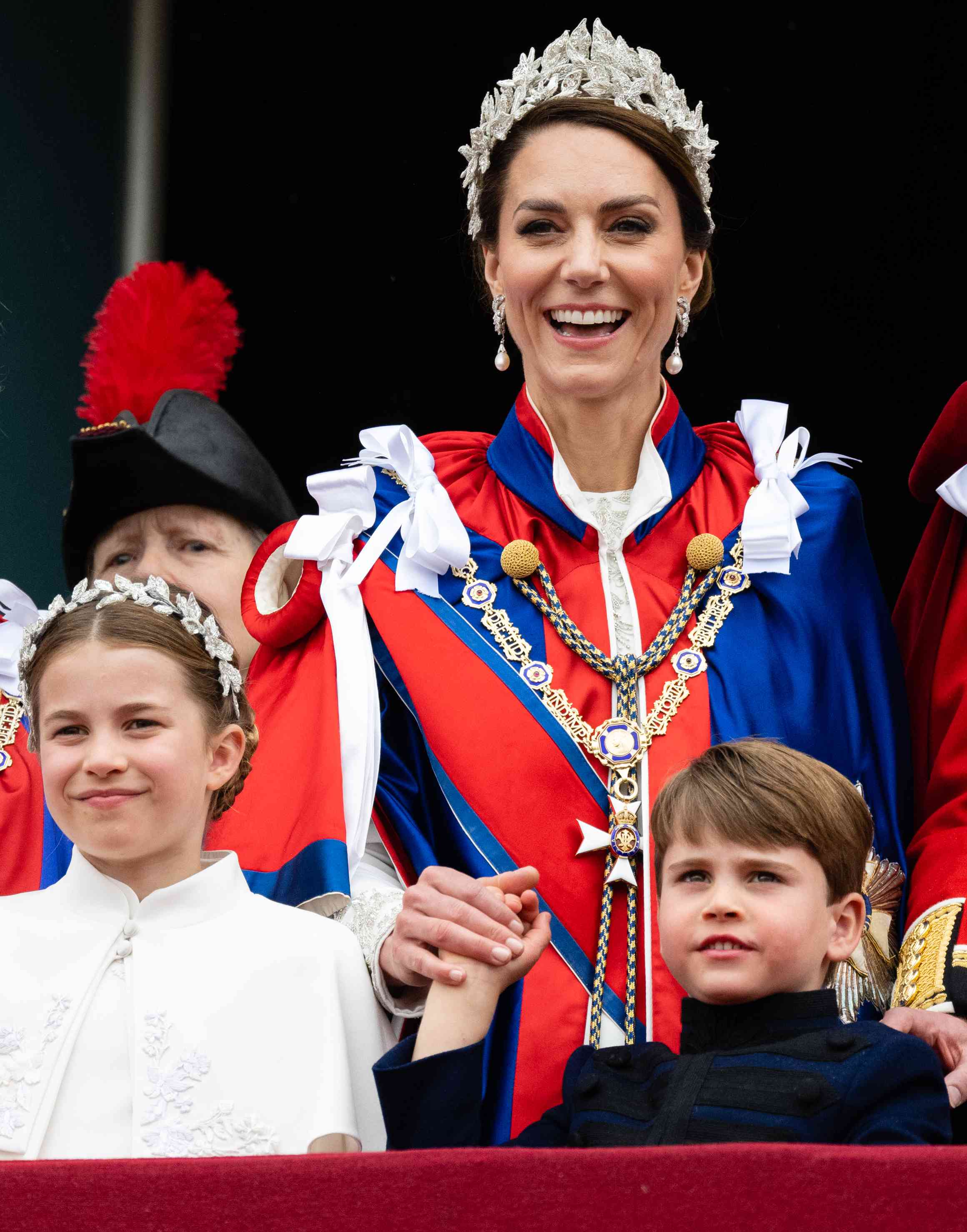 Princess Charlotte of Wales, Catherine, Princess of Wales and Prince Louis of Wales on the balcony of Buckingham Palace following the Coronation of King Charles III and Queen Camilla on May 06, 2023 in London, England. 