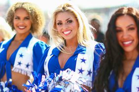 Dallas Cowboys Cheerleaders look on from the grid prior to the F1 Grand Prix of United States at Circuit of The Americas on October 22, 2023 in Austin, Texas. 