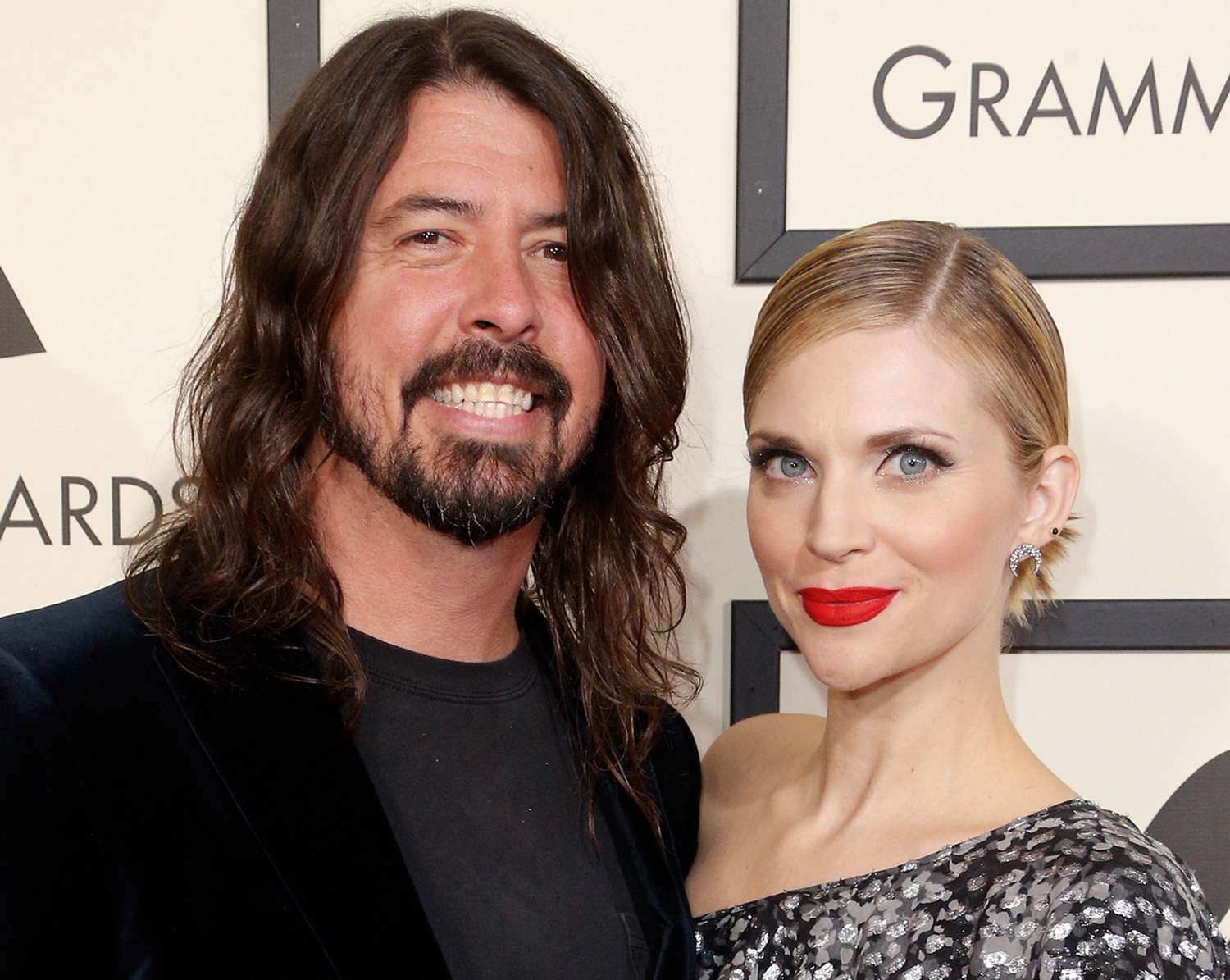 Dave Grohl of Foo Fighters (L) and Jordyn Blum attend The 58th GRAMMY Awards at Staples Center on February 15, 2016 in Los Angeles, California