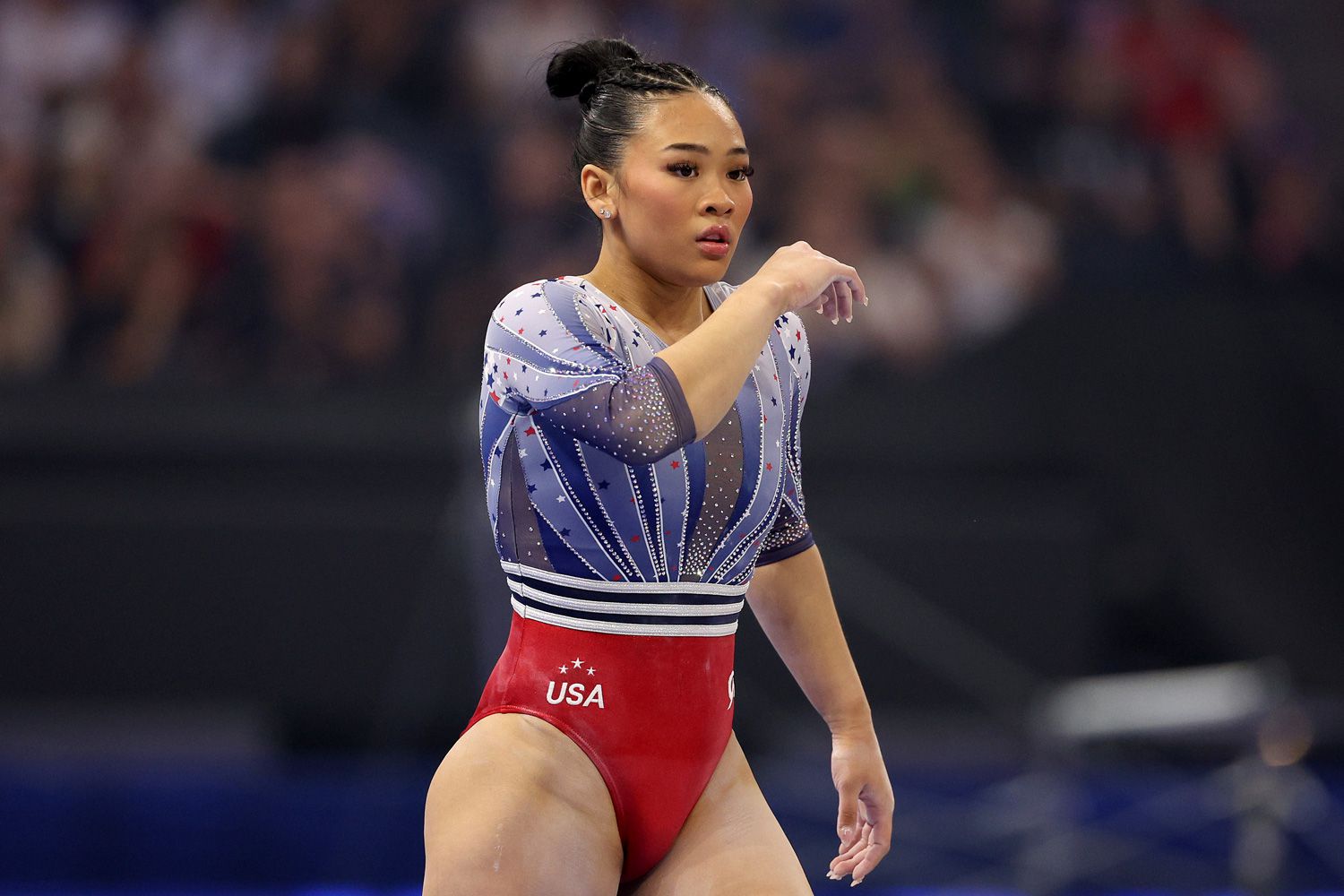 Suni Lee reacts after finishing her routine on the balance beam on Day Four of the 2024 U.S. Olympic Team Gymnastics Trials at Target Center on June 30, 2024 