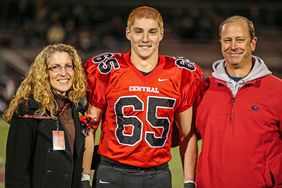 Timothy Piazza (center) with his parents Evelyn Piazza and James Piazza