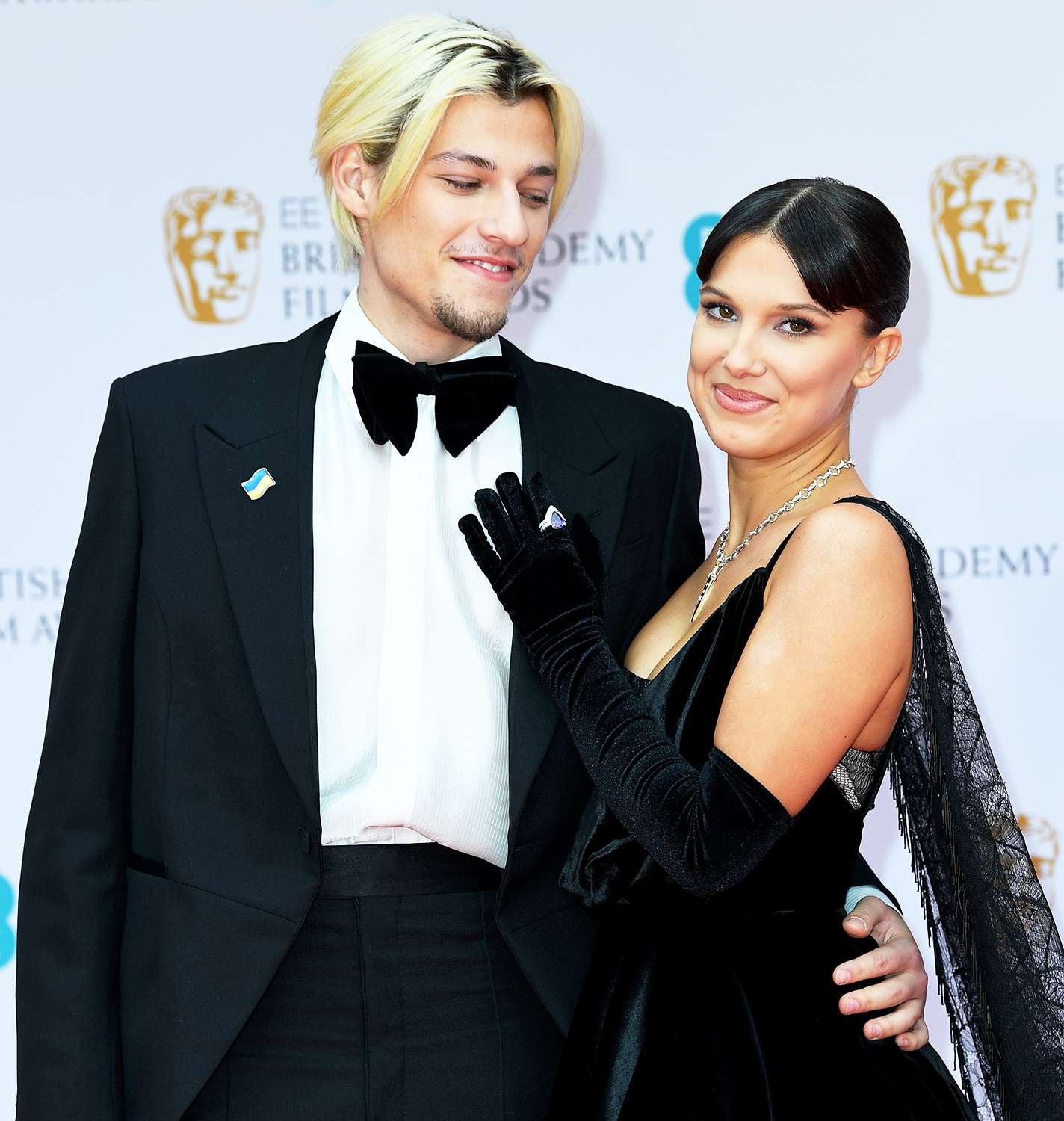 Jake Bongiovi and Millie Bobby Brown attend the EE British Academy Film Awards 2022 at Royal Albert Hall on March 13, 2022 in London, England.