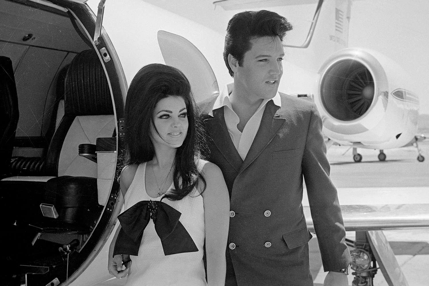 Newlyweds Elvis and Priscilla Presley, who met while Elvis was in the Army, prepare to board their private jet following their wedding at the Aladdin Resort and Casino in Las Vegas