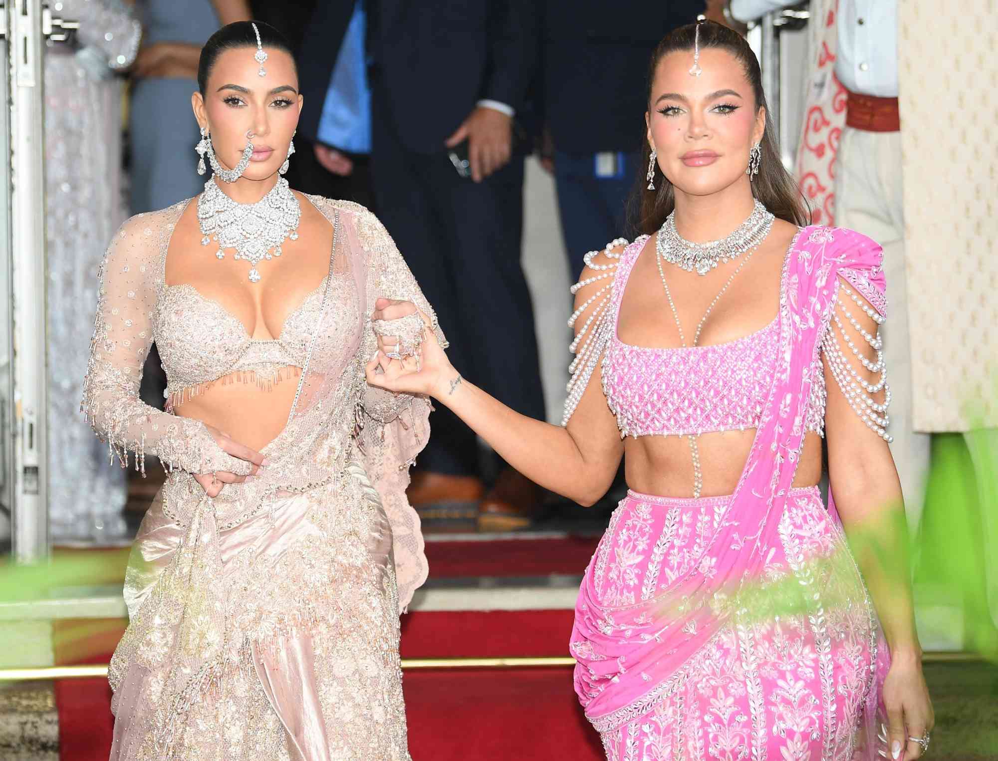 Kim Kardashian and Khloe Kardashian look stunning as they are seen heading out to the wedding of Anant Ambani and Radhika Merchant.