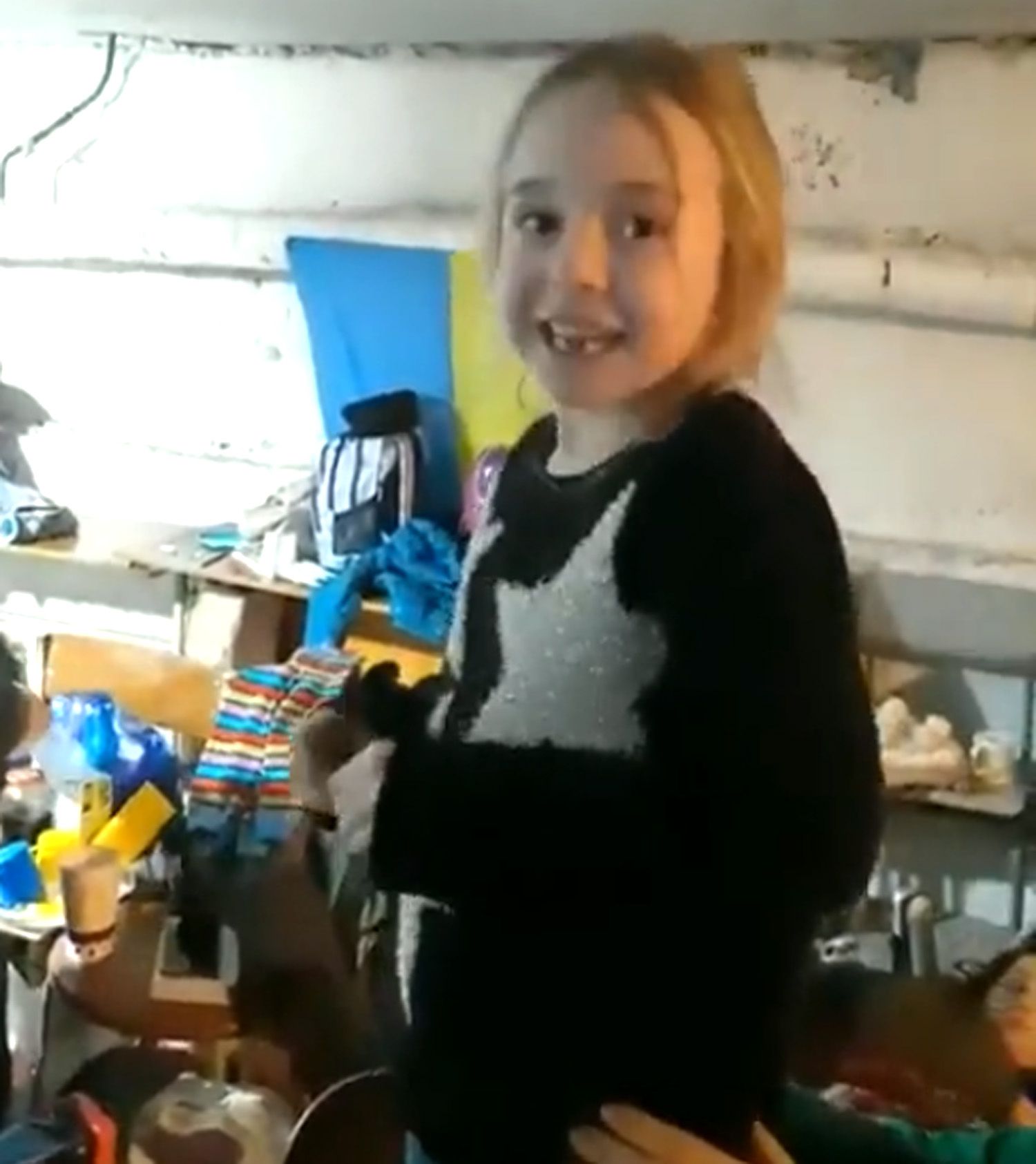 Little girl singing "Let it go" in a shelter