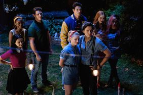 Riverdale -- "Chapter Fifty-Eight: In Memoriam" -- Image Number: RVD401b_0209.jpg -- Pictured (L-R): Camila Mendes as Veronica, Ashleigh Murray as Josie, Casey Cott as Kevin, Charles Melton as Reggie, Lili Reinhart as Betty, Cole Sprouse as Jughead, Madelaine Petsch as Cheryl and Vanessa Morgan as Toni -- Photo: Robert Falconer/The CW -- &copy; 2019 The CW Network, LLC. All Rights Reserved.