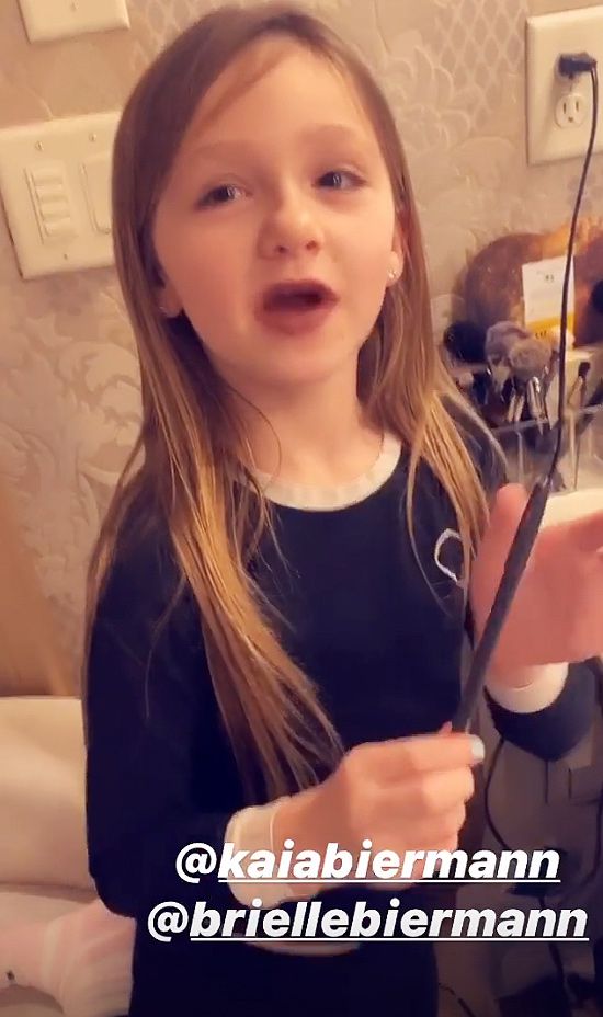 Kaia Biermann applying lipstick like her big sister Brielle