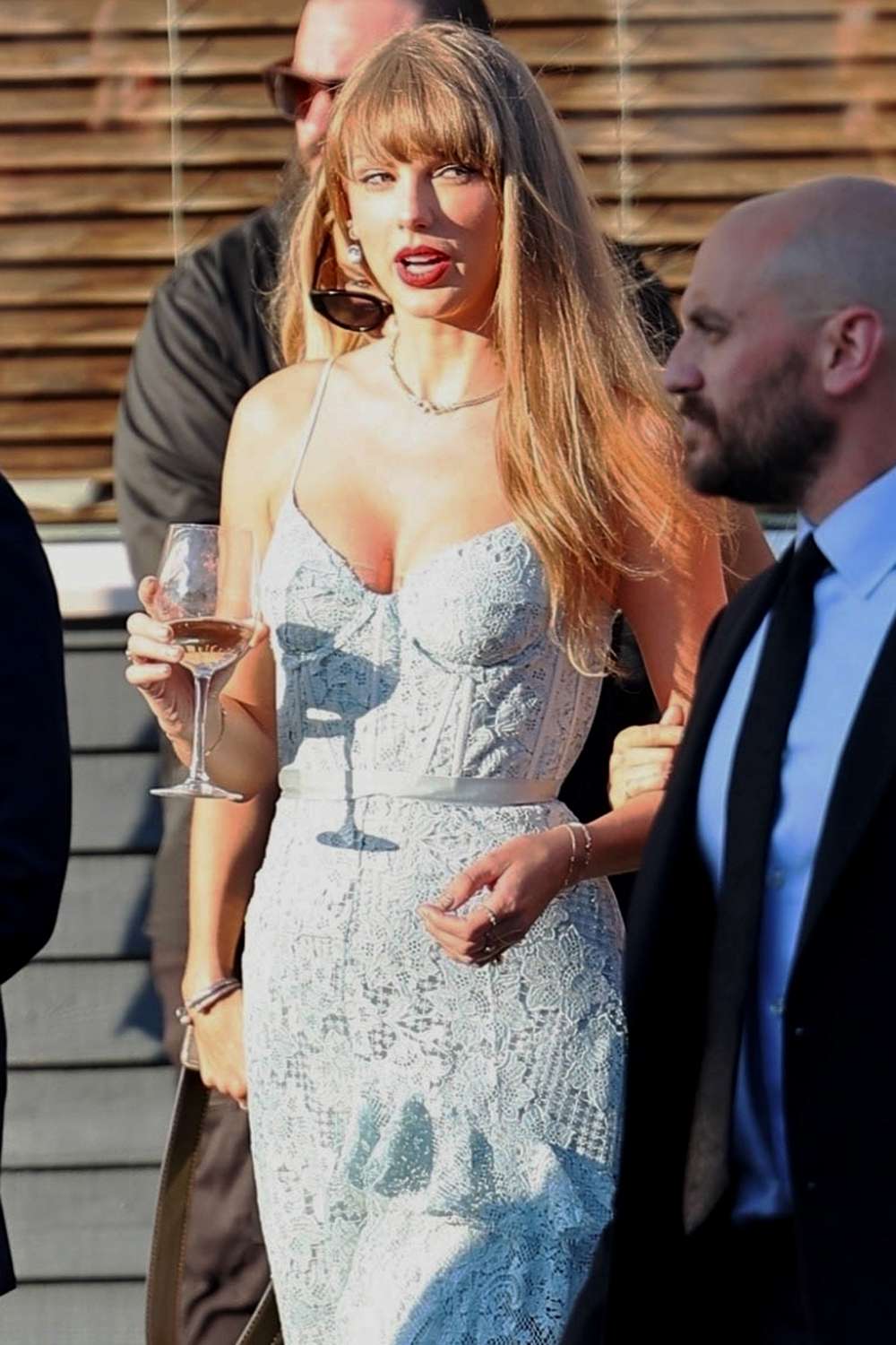 Taylor Swift stuns as she arrives at the wedding reception of friends Margaret Qualley and Jack Antanoff!