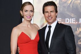 Actors Emily Blunt and Tom Cruise attend the "Edge Of Tomorrow" red carpet repeat fan premiere tour at AMC Loews Lincoln Square on May 28, 2014 in New York City.