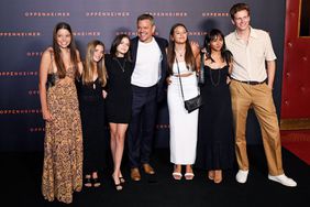 US actor Matt Damon (C) poses with his daughters Isabella Damon, Gia Zavala Damon and Stella Damon upon their arrival for the "Premiere" of the movie "Oppenheimer" at the Grand Rex cinema in Paris on July 11, 2023