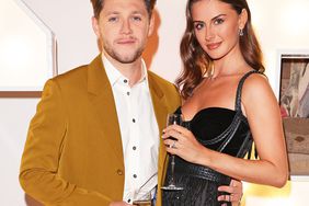 Niall Horan and Mia Woolley attend the Horan & Rose Show: Modest! Golf co-founder Niall Horan and Justin Rose brought the world of music and sport together at The Grove, presenting an evening of entertainment to raise money for The Black Heart Foundation on September 03, 2021 in Watford, England.