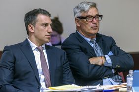 Attorney Alex Spiro, left, sits next to his client, actor Alec Baldwin in District Court in Santa Fe, N.M., during a preliminary hearing on Monday, July 8, 2024. 