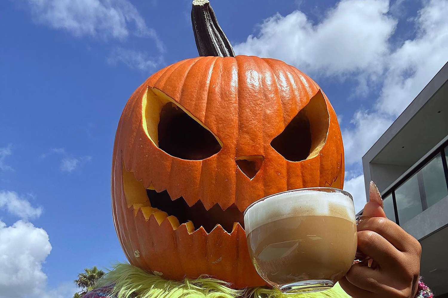 Megan Thee Stallion Gets Into the Halloween Spirit Early with Giant Pumpkin Head Mask 