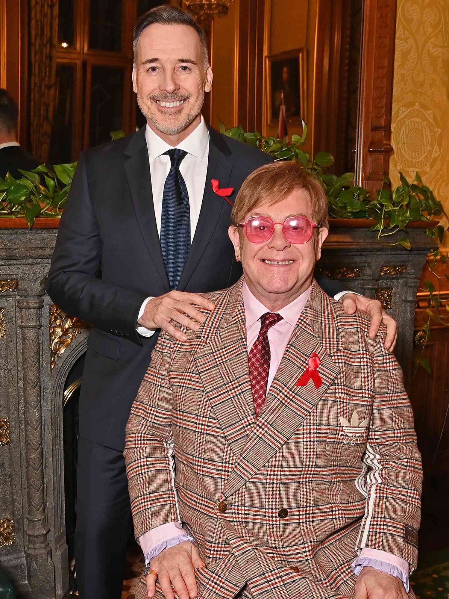 David Furnish and Sir Elton John attend a reception honouring Sir Elton John in recognition of his enduring commitment to ending the AIDS epidemic on November 29, 2023 in London, England.