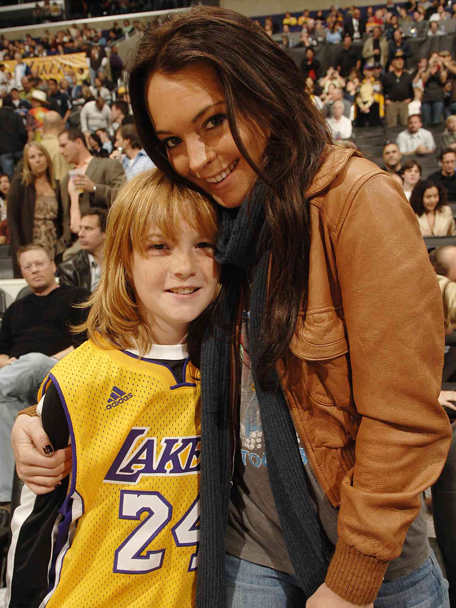 Lindsay Lohan poses with brother Cody during haltime of the Los Angeles Lakers versus the Atlanta Hawks on December 8, 2006 in Los Angeles, California.