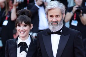 Scott Mackinlay Hahn and Winona Ryder attend a red carpet for the movie "Beetlejuice Beetlejuice" during the 81st Venice International Film Festival at on August 28, 2024