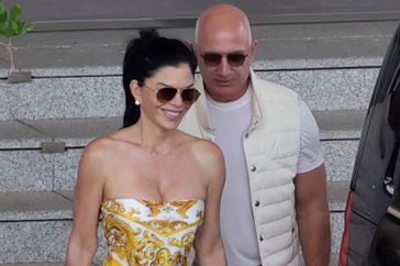  Lauren Sanchez and Amazon founder/billionaire partner Jeff Bezos arrive at the Cagliari Airport to attend the Dolce and Gabbana show. 