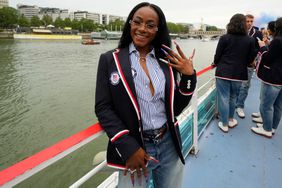 Sha'Carri Richardson poses for a photo while riding with teammates on a boat with teammates along the Seine River during the Opening Ceremony of the Olympic Games Paris 2024 on July 26, 2024 in Paris, France. 