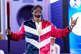 US rapper Snoop Dogg performs the Coup de Baton ceremony before athletes are competing in the B-Girls Round Robin during Day 14 of Breaking - Olympic Games Paris 2024 at Place de la Concorde on August 9, 2024 in Paris, France