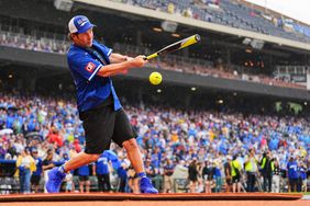 Paul Rudd swings at a pitch in a Celebrity Softball game at Kauffman Stadium during the Big Slick Celebrity Weekend benefiting Children's Mercy Hospital on May 31, 2024 in Kansas City, Missouri. 