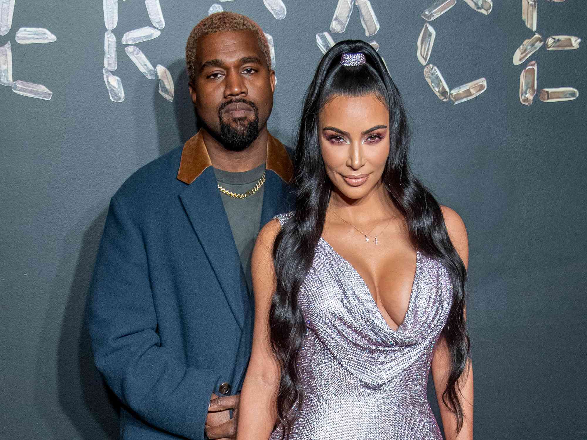 Kanye West and Kim Kardashian West attend the the Versace fall 2019 fashion show at the American Stock Exchange Building in lower Manhattan on December 02, 2018 in New York City