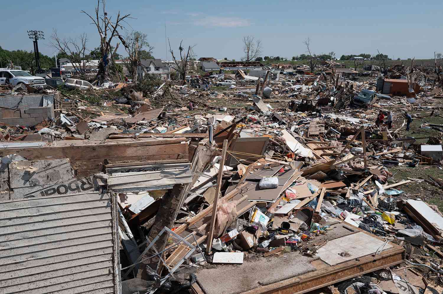 GREENFIELD, IOWA - MAY 22: Residents go through the damage after a tornado tore through town yesterday afternoon on May 22, 2024 in Greenfield, Iowa. Multiple deaths and injuries have been reported from a series of tornadoes and powerful storms that hit several Midwestern states. 