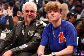 Television personality Guy Fieri poses with his son Ryder Fieri prior to the 2023 NBA All Star Game between Team Giannis and Team LeBron at Vivint Arena on February 19, 2023 