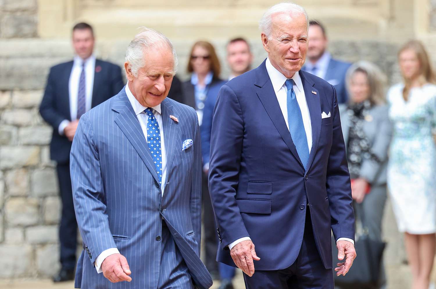 King Charles III and The President of the United States, Joe Biden walk together in the Quadrangle at Windsor Castle