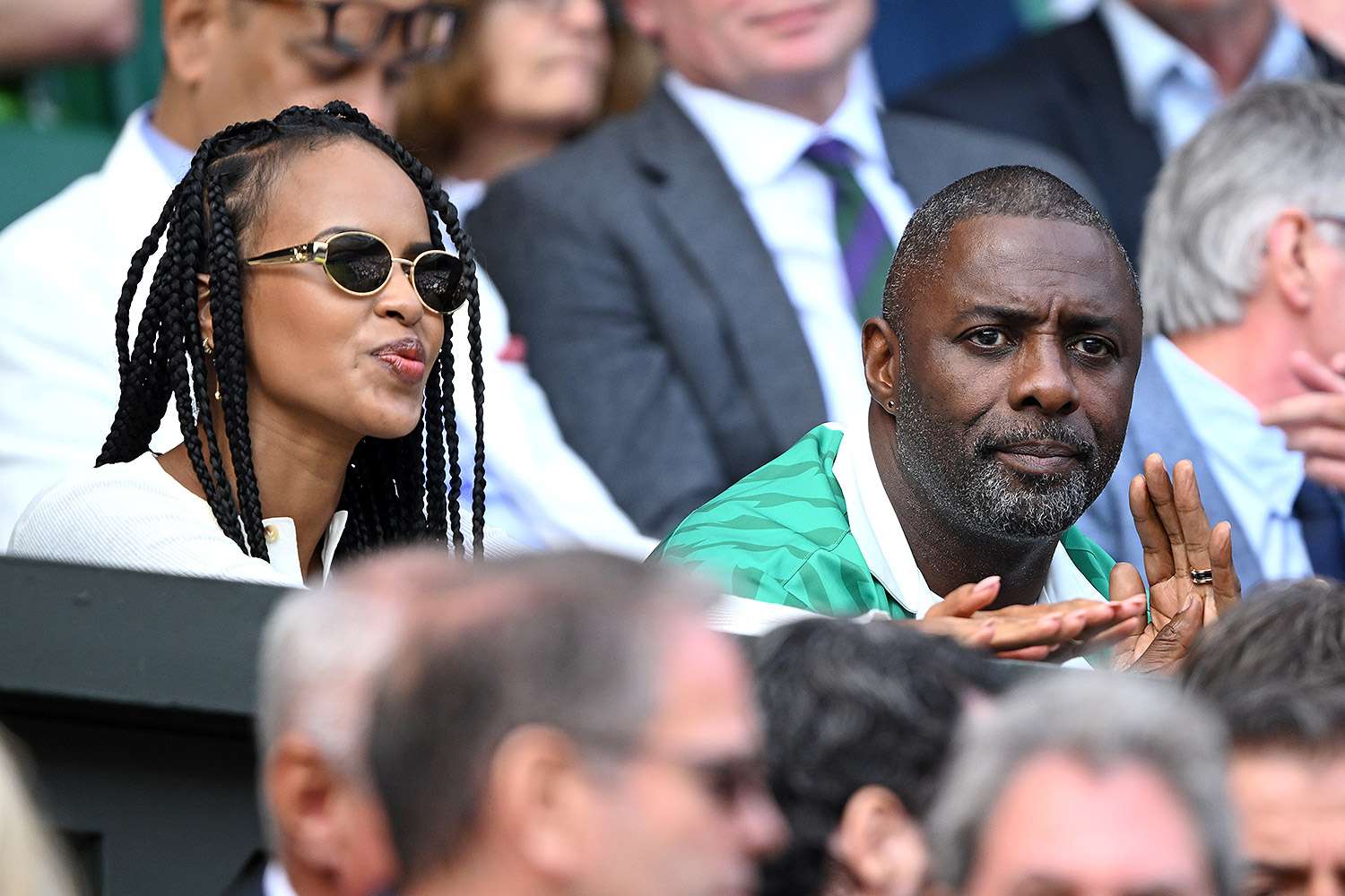 Sabrina Dhowre Elba and Idris Elba watch Carlos Alcaraz vs Novak Djokovic in the Wimbledon 2023 men's final on Centre Court during day fourteen of the Wimbledon Tennis Championships at the All England Lawn Tennis and Croquet Club on July 16, 2023 in London, England. 