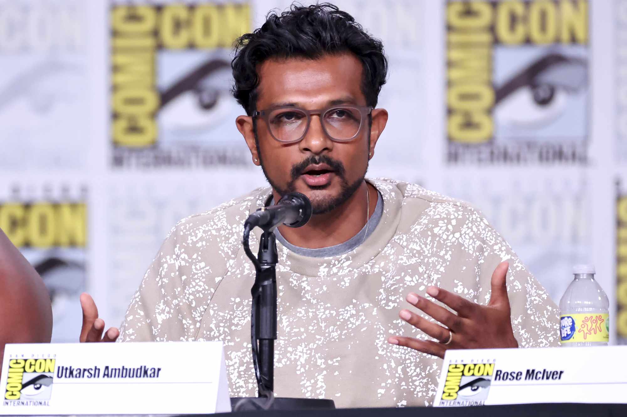 SAN DIEGO, CALIFORNIA - JULY 21: Utkarsh Ambudkar speaks onstage at the "Ghosts" panel during 2022 Comic-Con International: San Diego at San Diego Convention Center on July 21, 2022 in San Diego, California. (Photo by Amy Sussman/Getty Images)