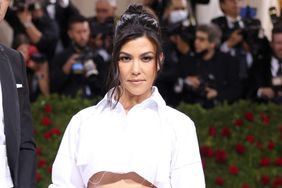 NEW YORK, NEW YORK - MAY 02: (L-R) Travis Barker and Kourtney Kardashian attend The 2022 Met Gala Celebrating "In America: An Anthology of Fashion" at The Metropolitan Museum of Art on May 02, 2022 in New York City. (Photo by John Shearer/Getty Images)