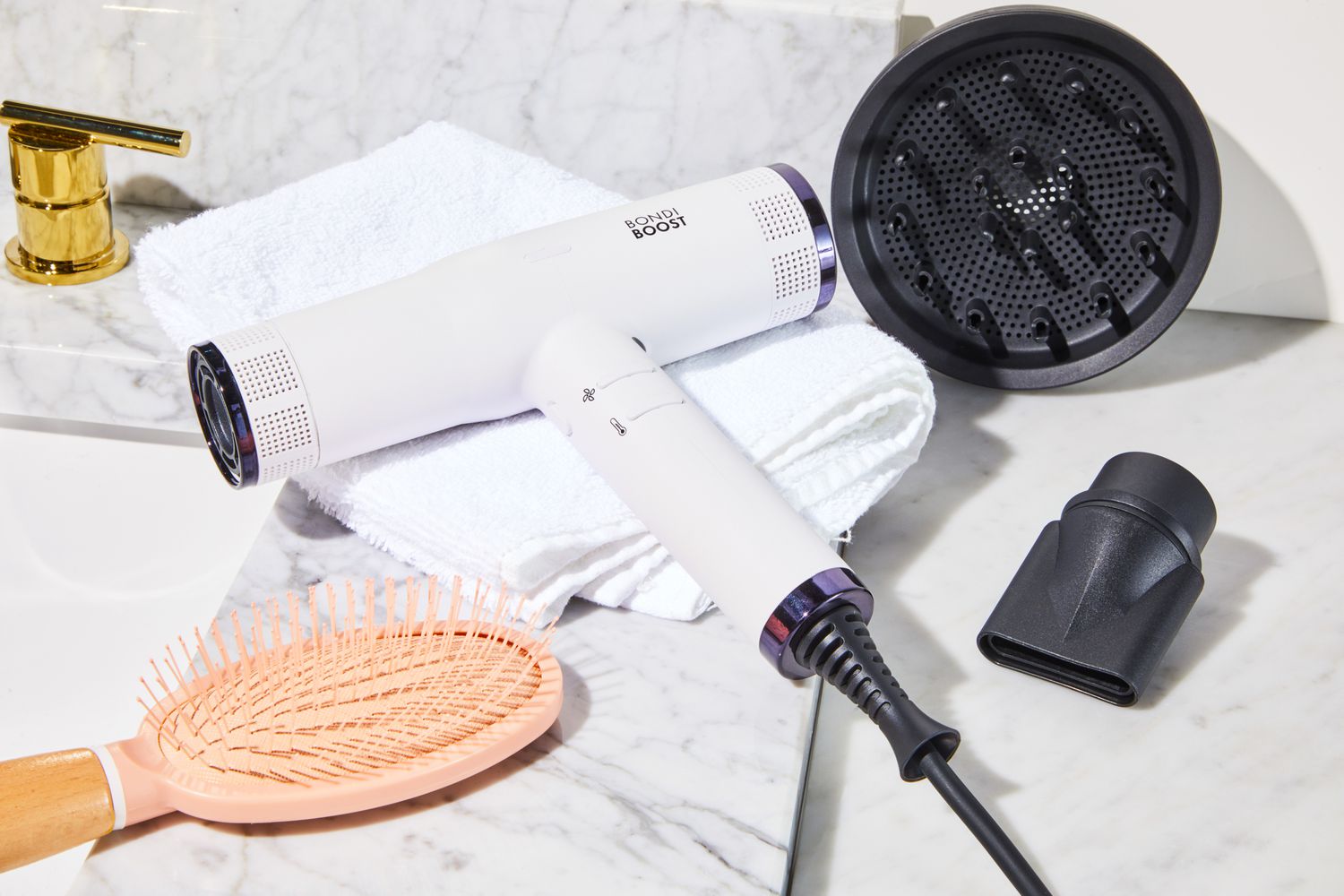 BondiBoost Sonic Hair Dryer and attachments on bathroom counter