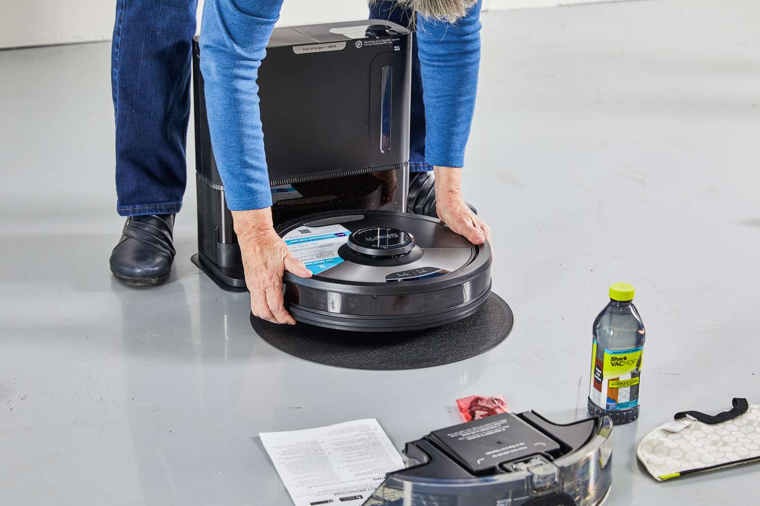 Person assembling Shark AI Ultra 2-in-1 Robot Vacuum & Mop