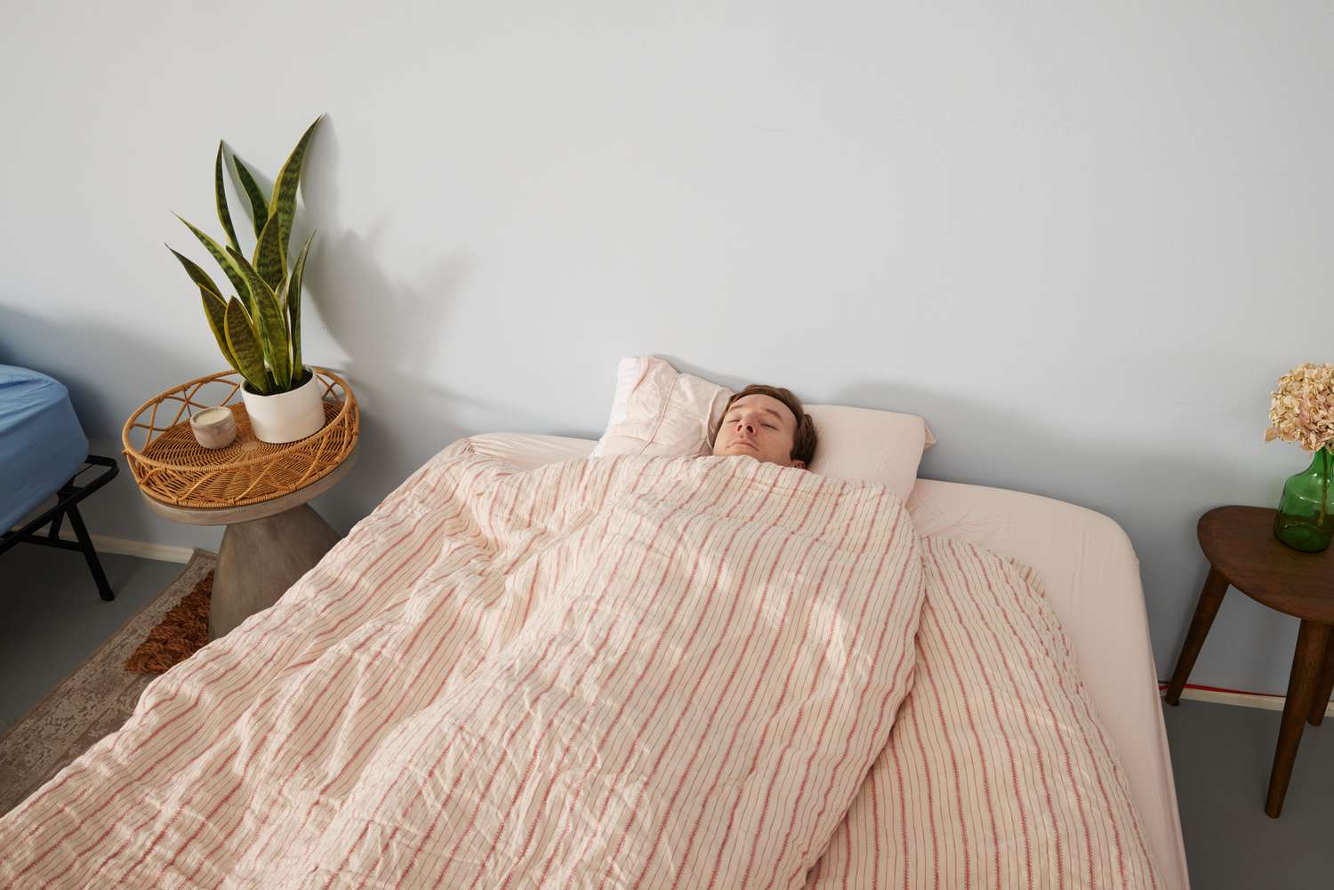 A person laying down in the Piglet In Bed Linen Duvet Cover