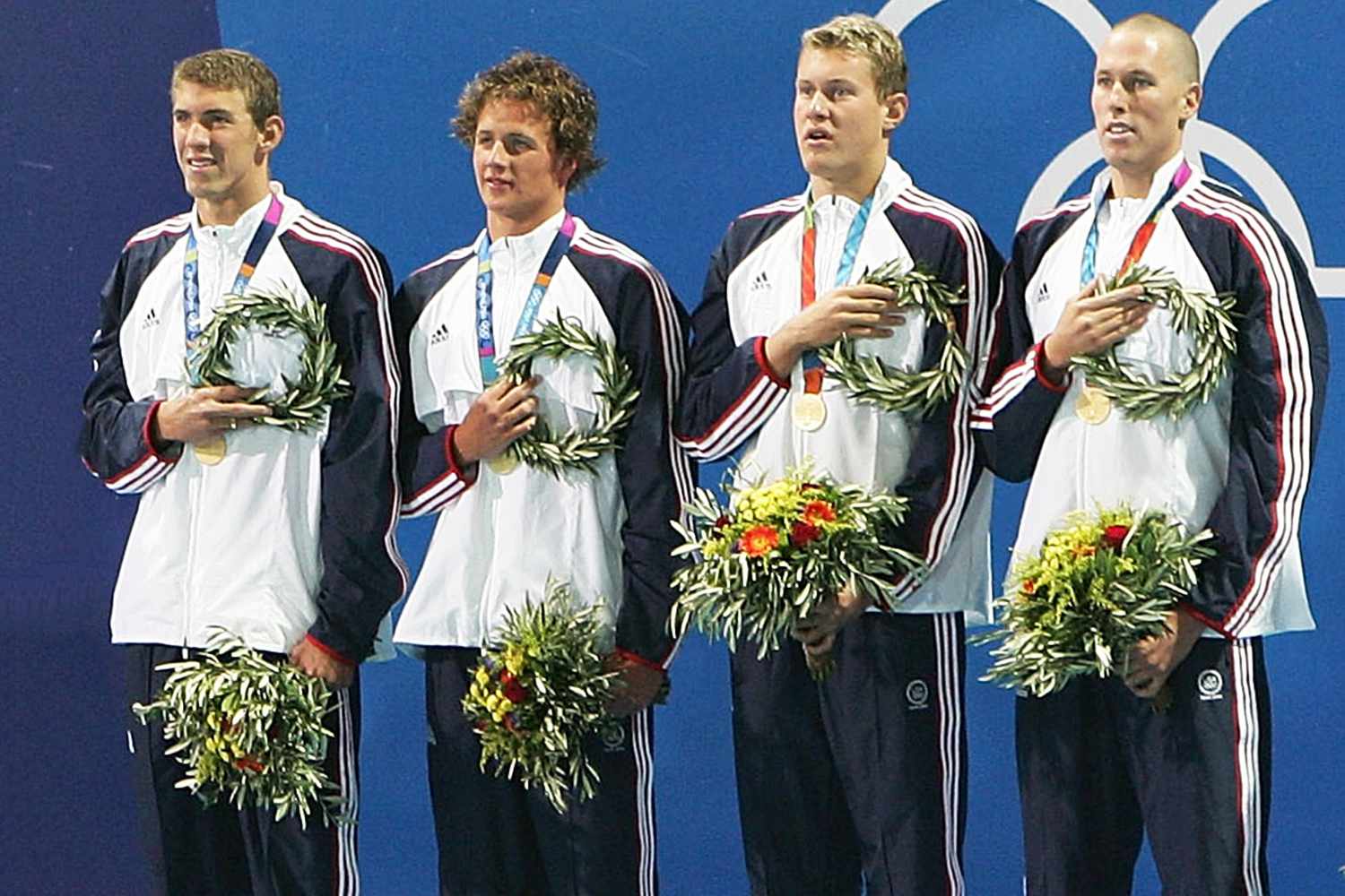 Michael Phelps, Ryan Lochte, Peter Vanderkaay and Klete Keller of USA celebrate on the podium during the men's swimming 4x200 metre freestyle relay event on August 17, 2004.