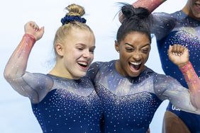 Joscelyn Roberson of the United States and Simone Biles of the United States celebrate the team's gold medal win during the Women's Team Final at the Artistic Gymnastics World Championships-Antwerp 2023 at the Antwerp Sportpaleis on October 4th, 2023 in Antwerp, Belgium