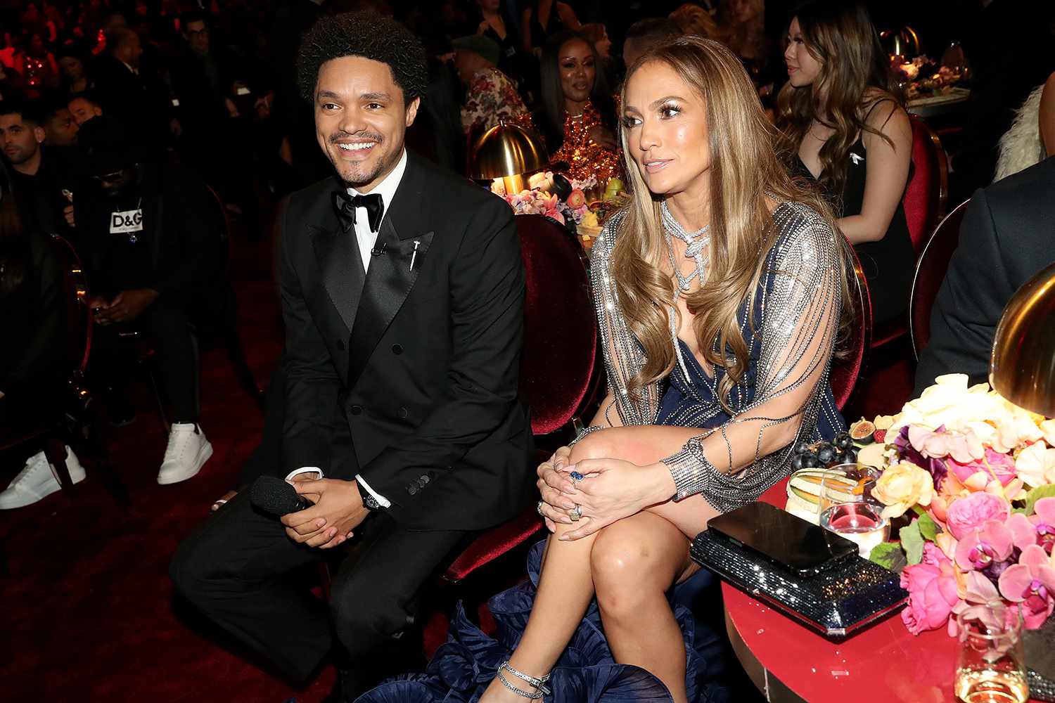 Host Trevor Noah and Jennifer Lopez smile during the 65th GRAMMY Awards at Crypto.com Arena on February 05, 2023 in Los Angeles, California. 