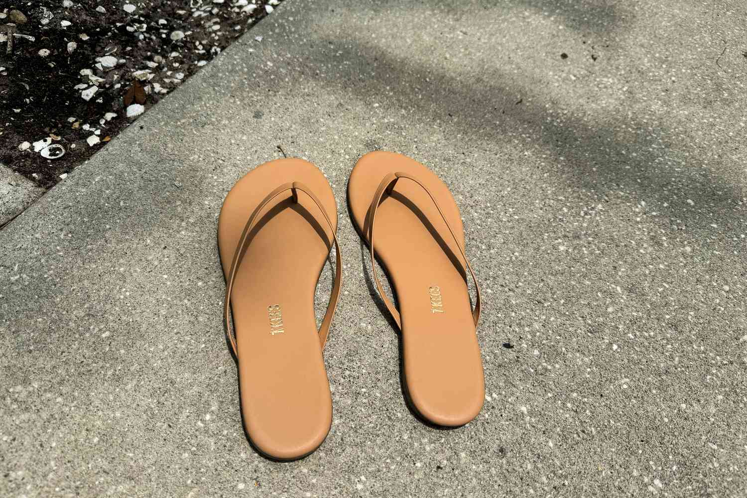 Tkees Flip-Flop Sandals on concrete 