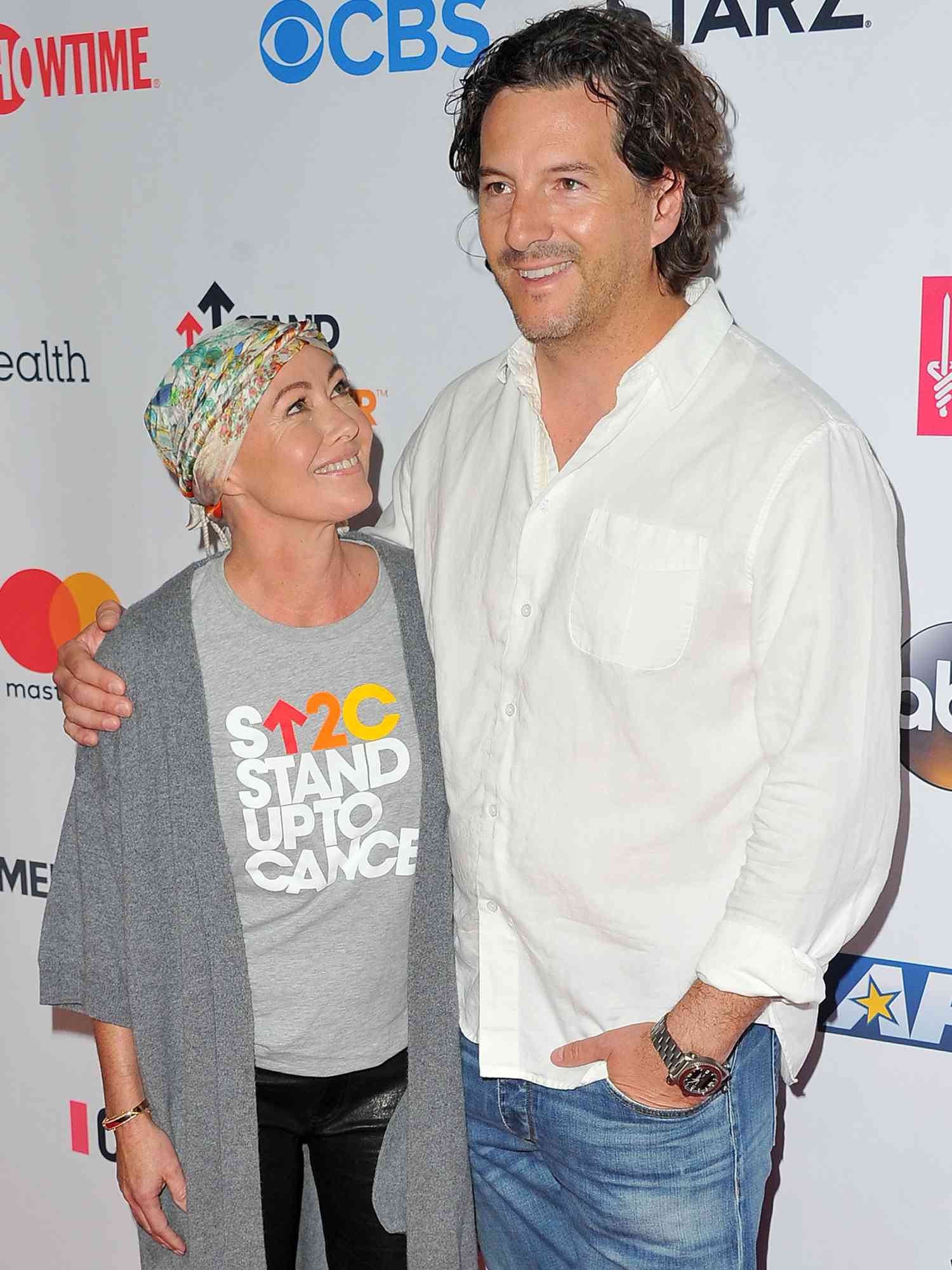 Shannen Doherty and Kurt Iswarienko arrive at the Hollywood Unites for the 5th Biennial Stand up to Cancer (SU2C) on September 9, 2016 in Los Angeles, California. 