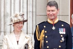 Princess Anne, Princess Royal and Vice Admiral Sir Tim Laurence watch a flypast to mark the centenary of the Royal Air Force from the balcony of Buckingham Palace on July 10, 2018